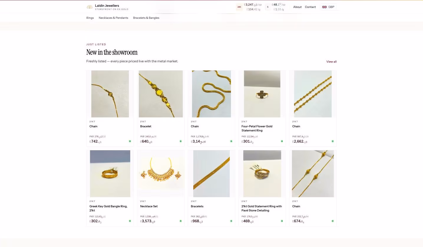 A branded vendor storefront on ex.gold — real pieces with dual-currency live pricing